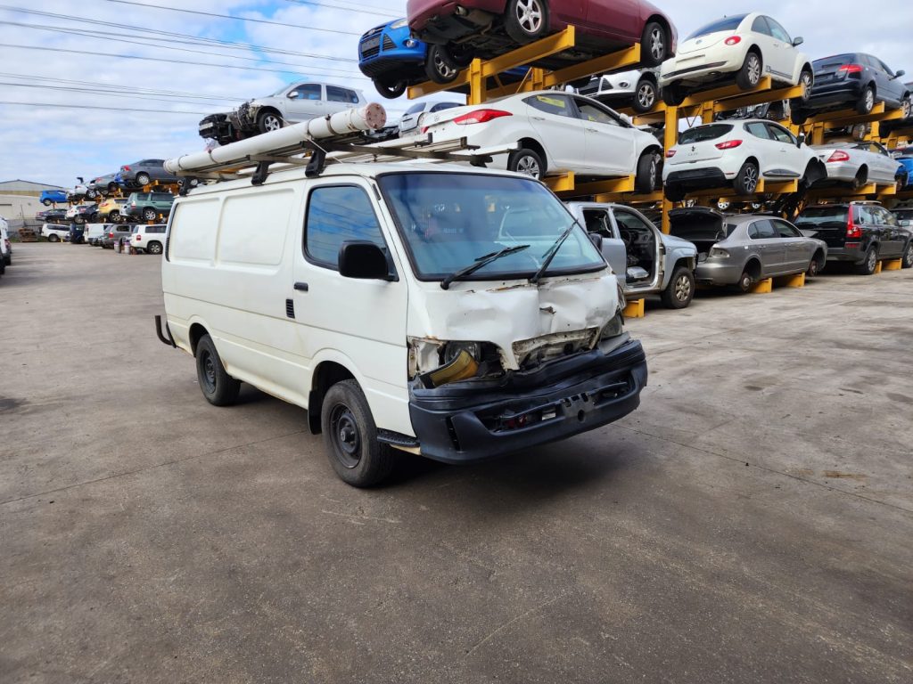 Cash for Scrap Cars Lang Lang VIC 1 White van parked in front of vehicle storage racks