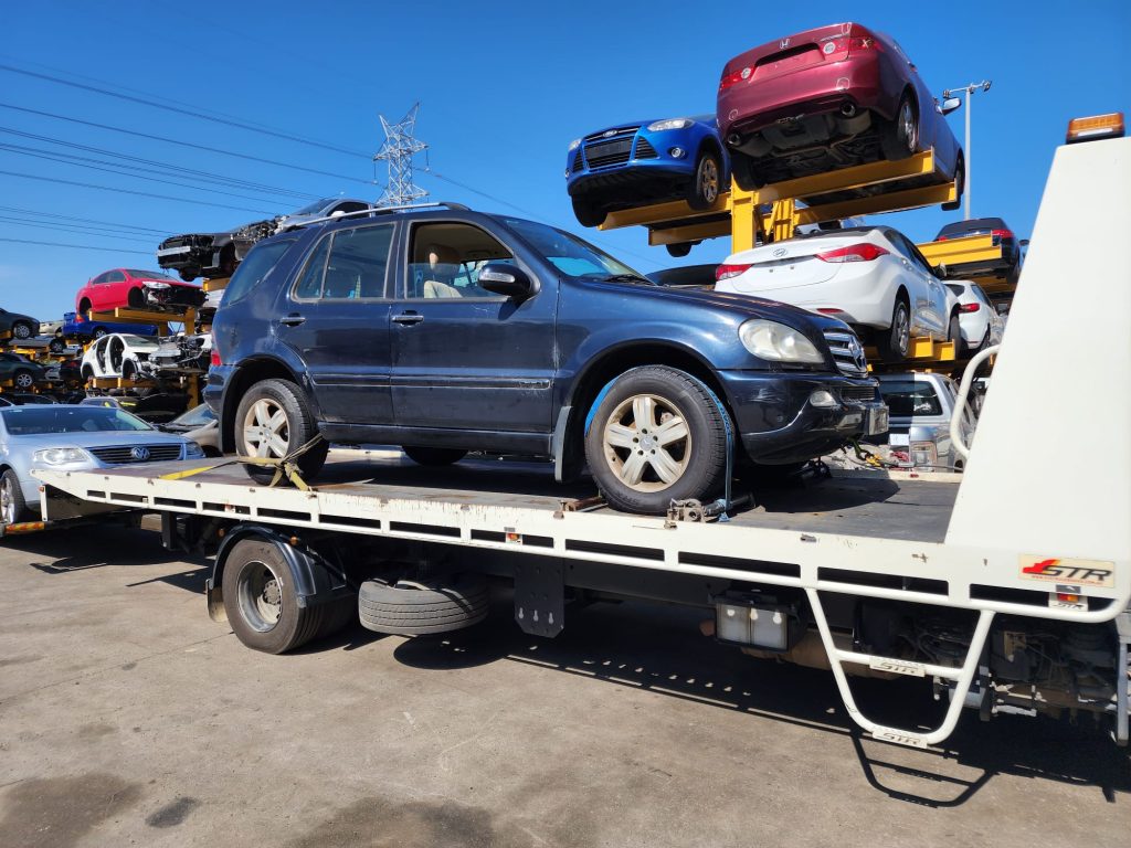 Cash for Scrap Cars Humevale VIC 1 Blue SUV loaded on a white flatbed tow truck
