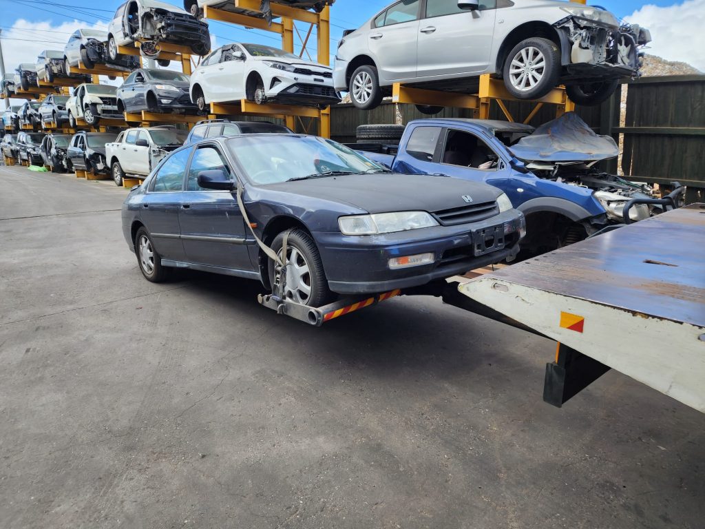 Cash for Scrap Cars Ripponlea VIC 1 Dark sedan positioned beside a flatbed loading ramp