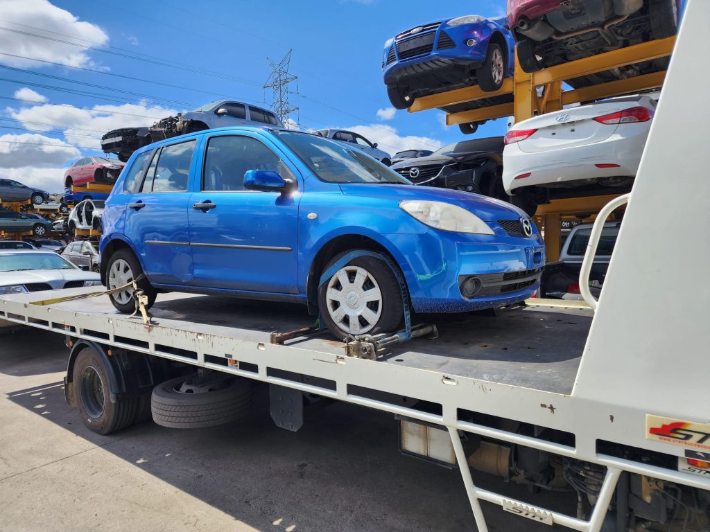 Cash for Scrap Cars Toolangi VIC 1 Blue hatchback secured on a flatbed tow truck