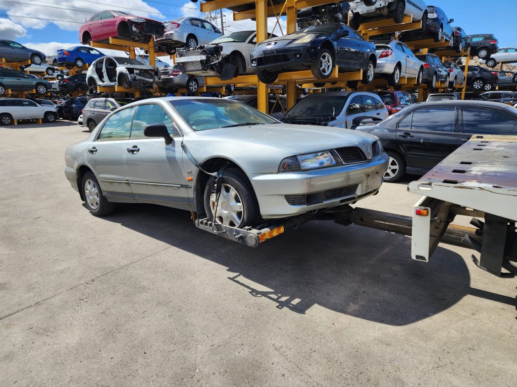 Cash for Scrap Cars Tremont VIC 1 White sedan being loaded onto a flatbed ramp