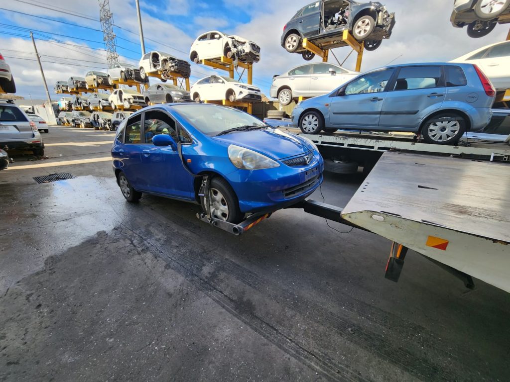 Cash for Scrap Cars Essendon Fields VIC 1 Blue hatchback at an automotive recycling yard