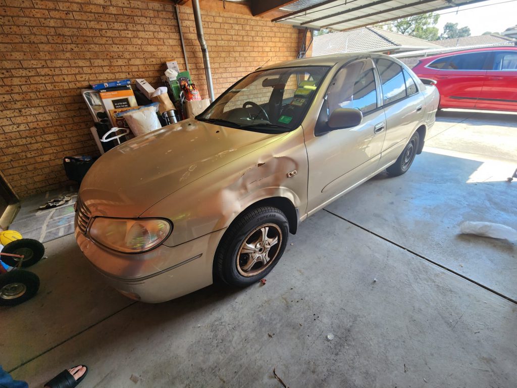 Cash for Scrap Cars Forest Hill VIC 1 Gold people mover parked in a garage