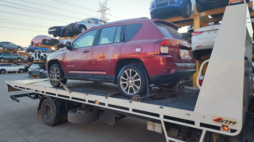 Cash for Scrap Cars Harkness VIC 1 Red SUV secured on a white flatbed truck