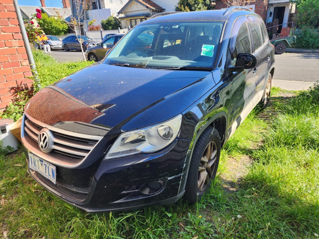 Cash for Scrap Cars Diggers Rest VIC 1 Black SUV parked on grass beside a driveway