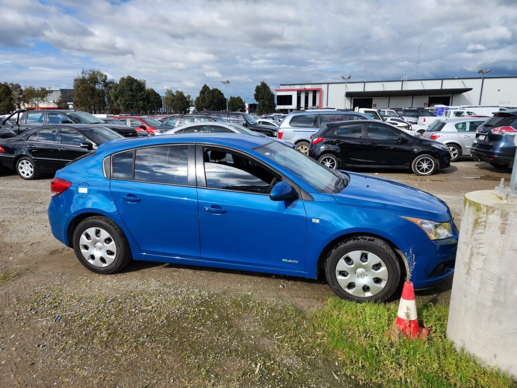Cash for Scrap Cars Hampton VIC 1 Blue sedan parked outside an automotive yard